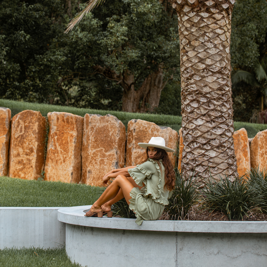 Model wearing the khaki green crop top and shorts with ruffle detail from Australian Fashion Brand Girl and the Sun