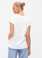 White dreamer motif tee with multicoloured letters