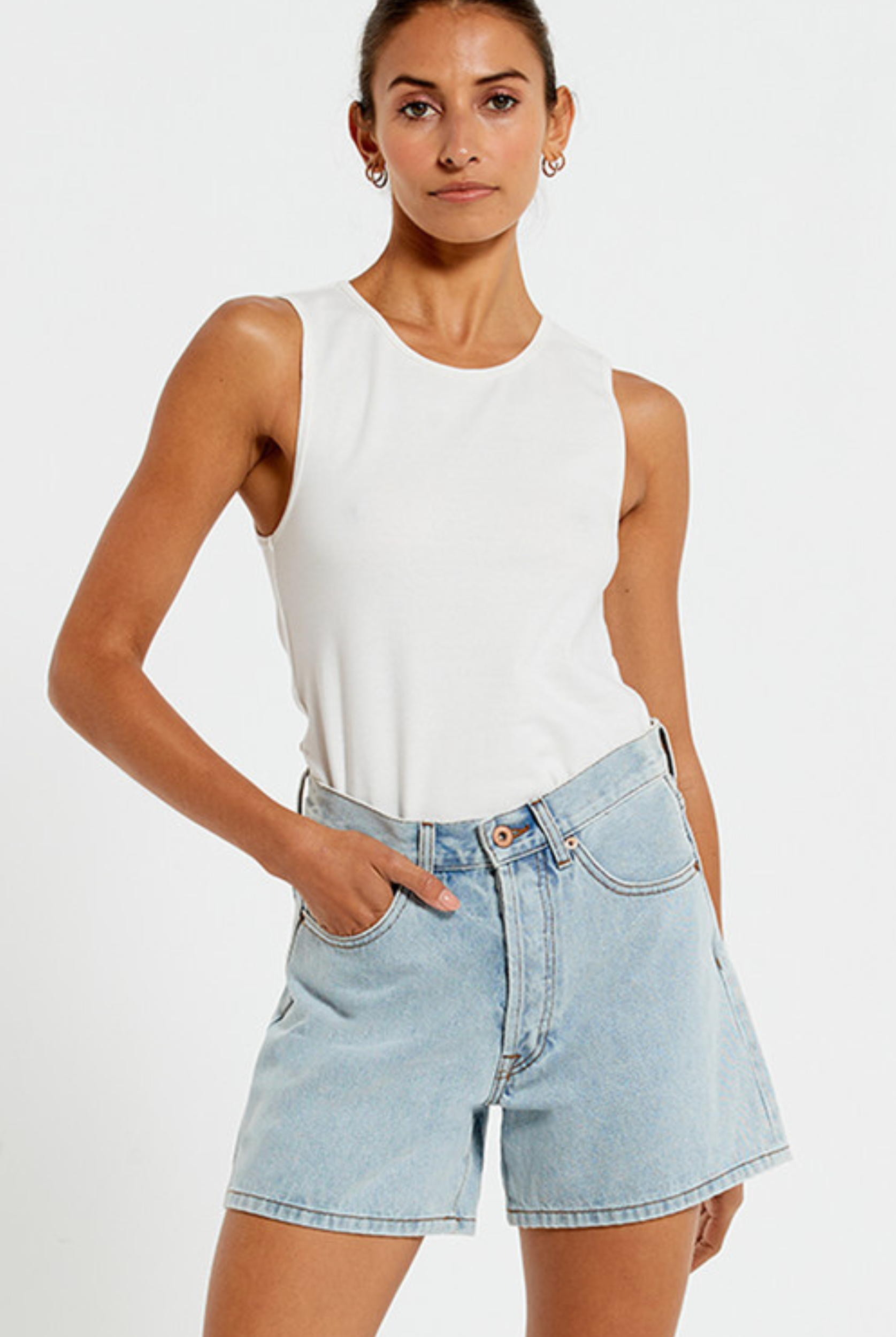 Model wearing the Bohemian Traders Mid Thigh ice wash short