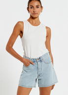 Model wearing the Bohemian Traders Mid Thigh ice wash short