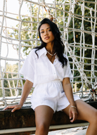 White linen shirt with short sleeve and white linen shorts