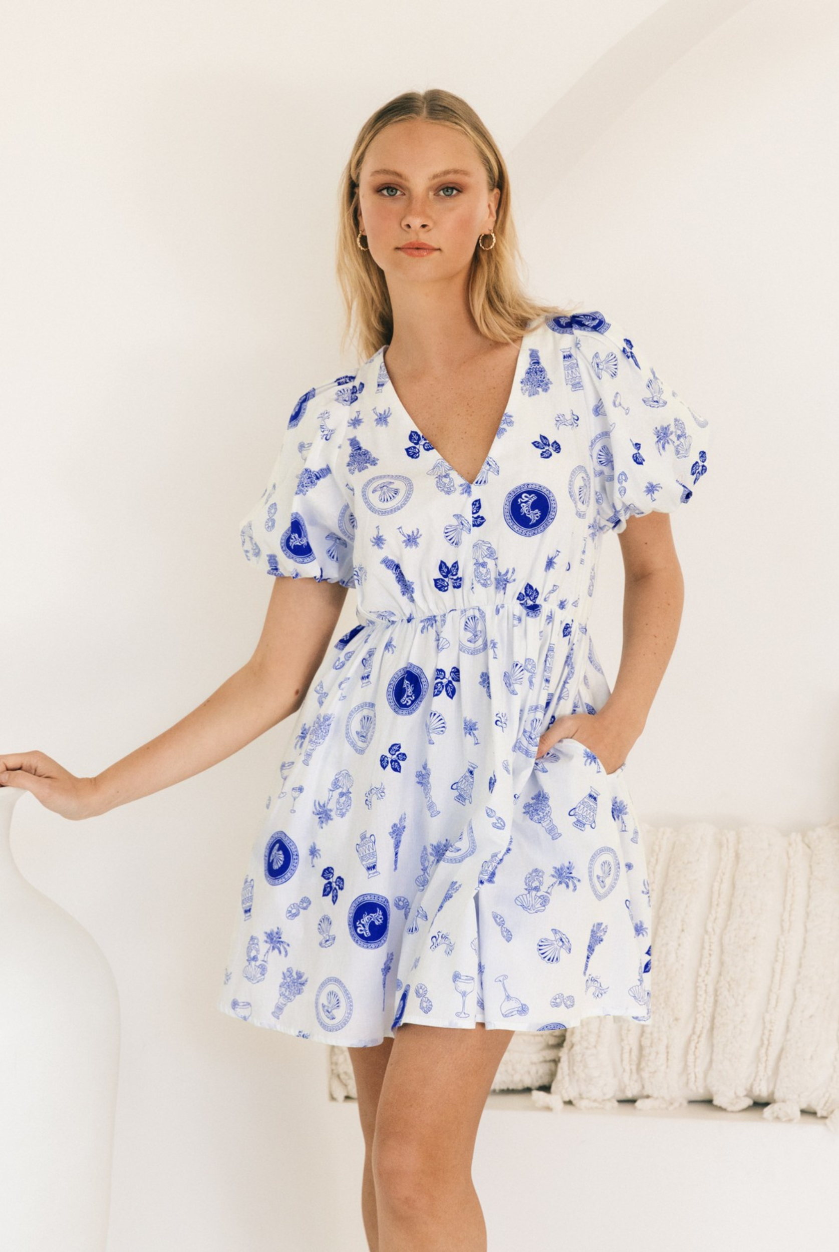 Model wearing the short sleeve Messina Mini Dress