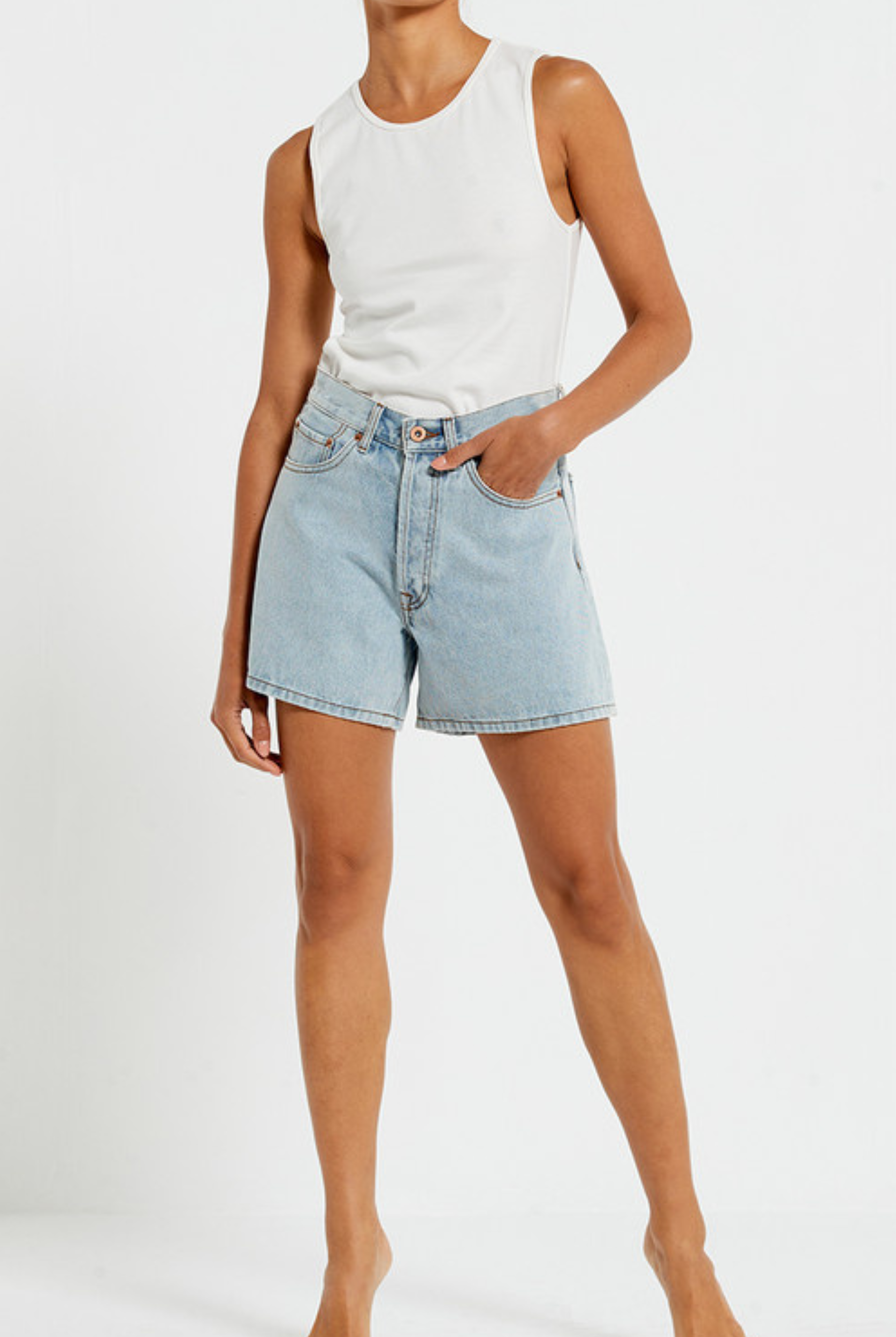 Model wearing the Bohemian Traders Mid Thigh ice wash short