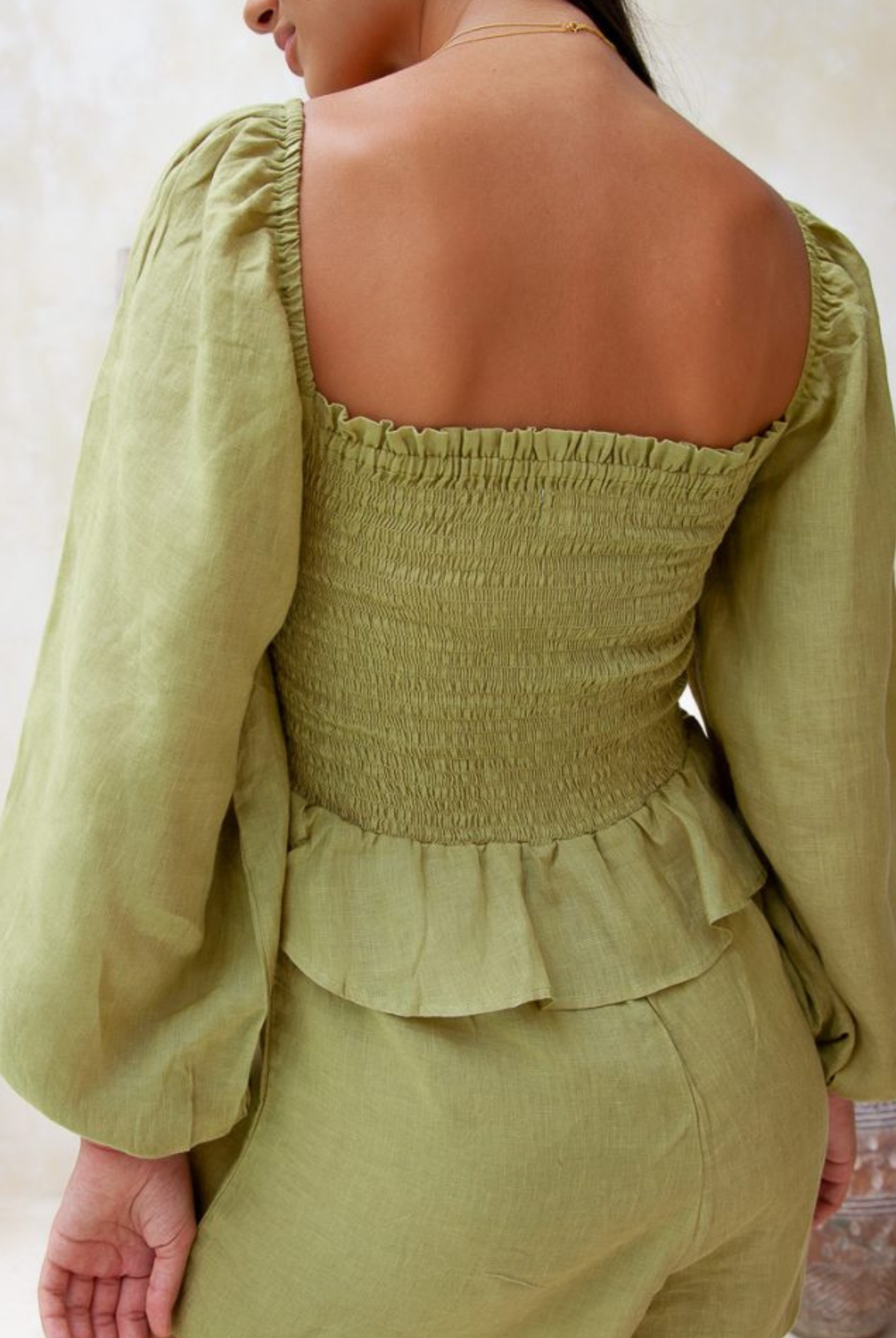 Moss green sustainable linen playsuit from Palm Collective