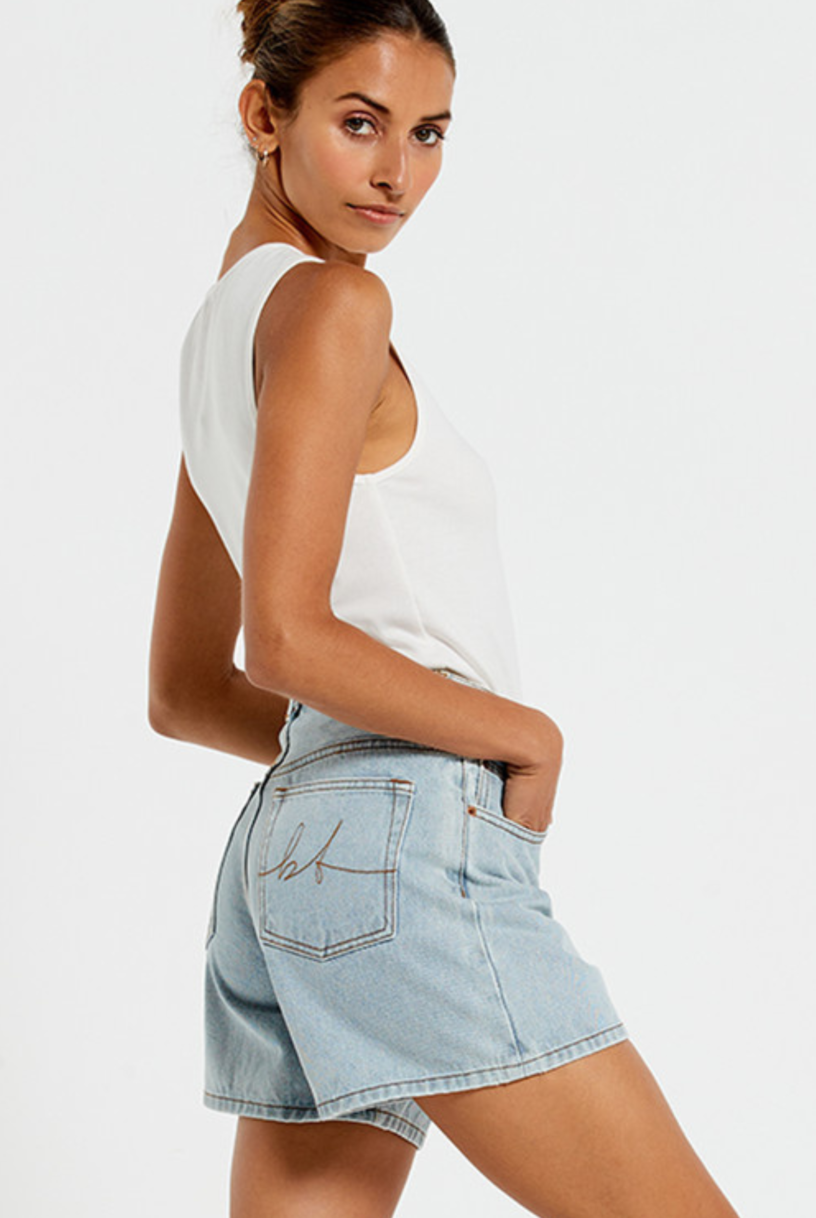 Model wearing the Bohemian Traders Mid Thigh ice wash short