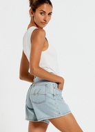 Model wearing the Bohemian Traders Mid Thigh ice wash short