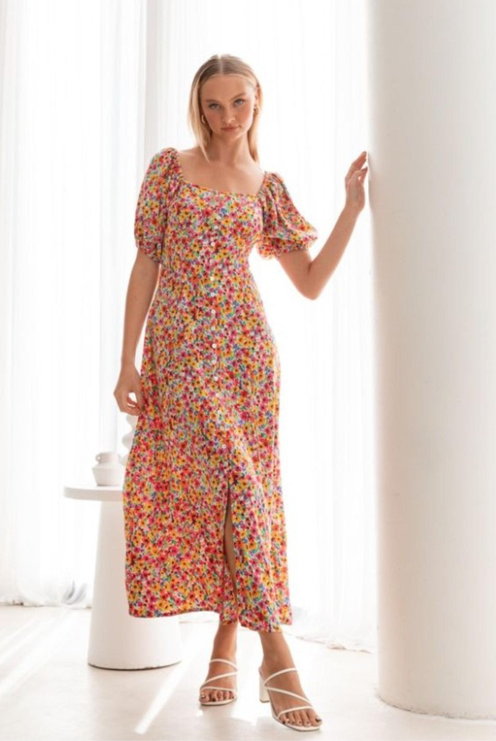 Model wearing the floral print Lucia Dress from Paper Heart