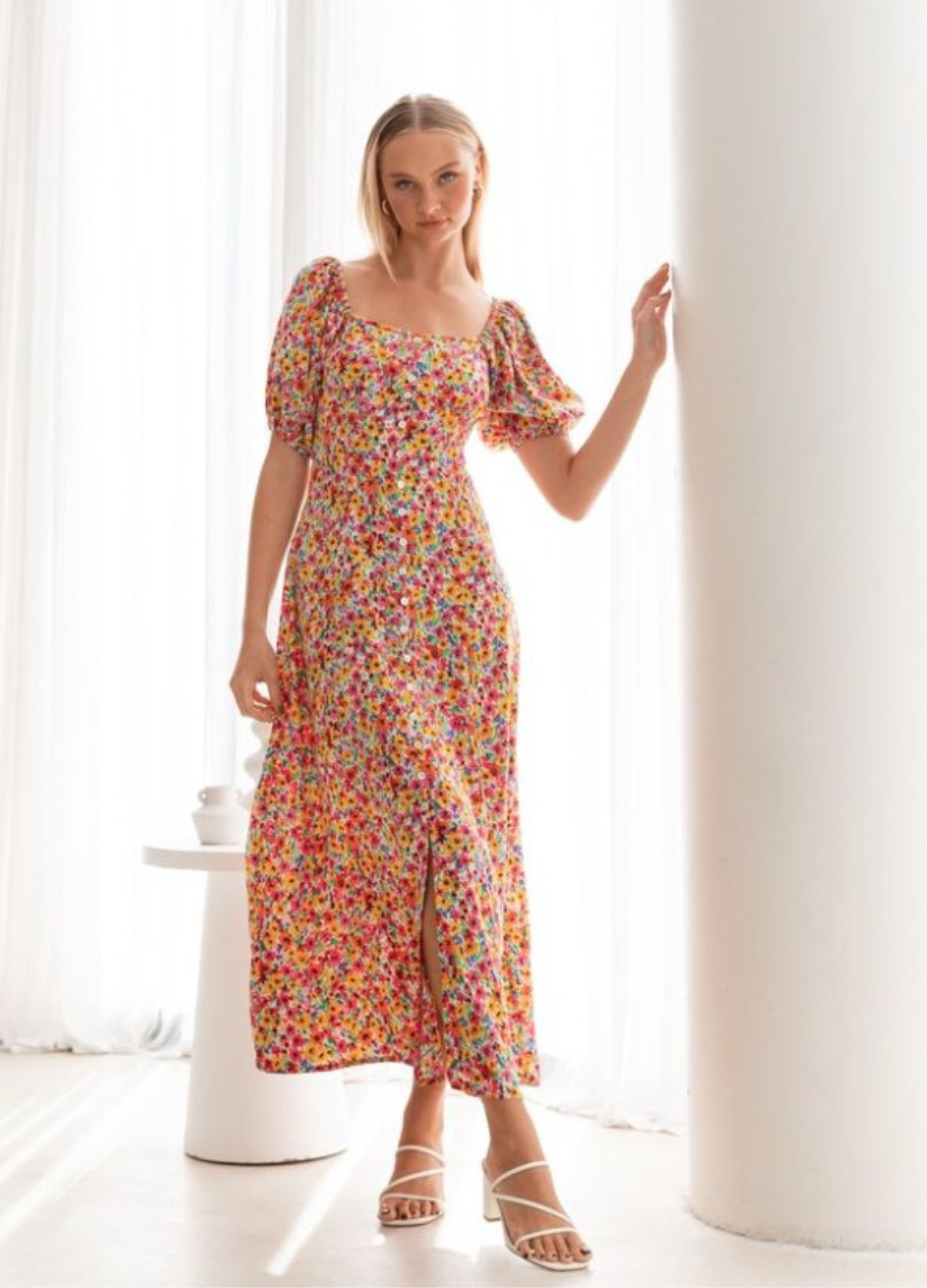 Model wearing the floral print Lucia Dress from Paper Heart