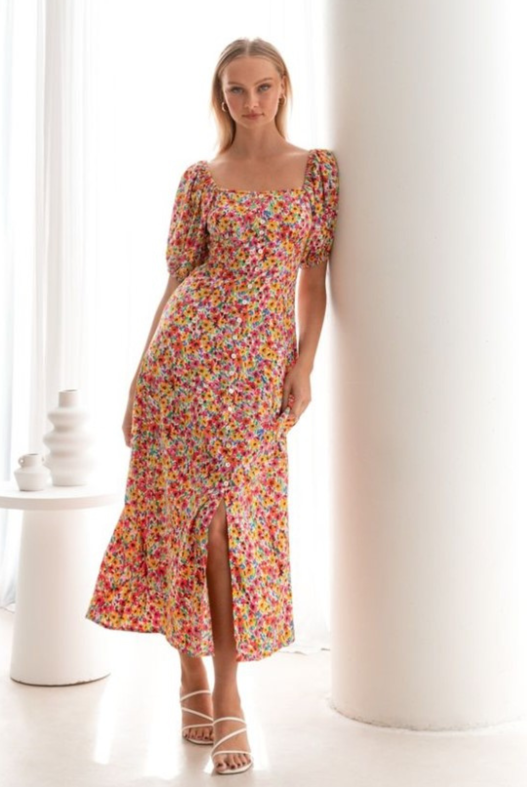 Model wearing the floral print Lucia Dress from Paper Heart