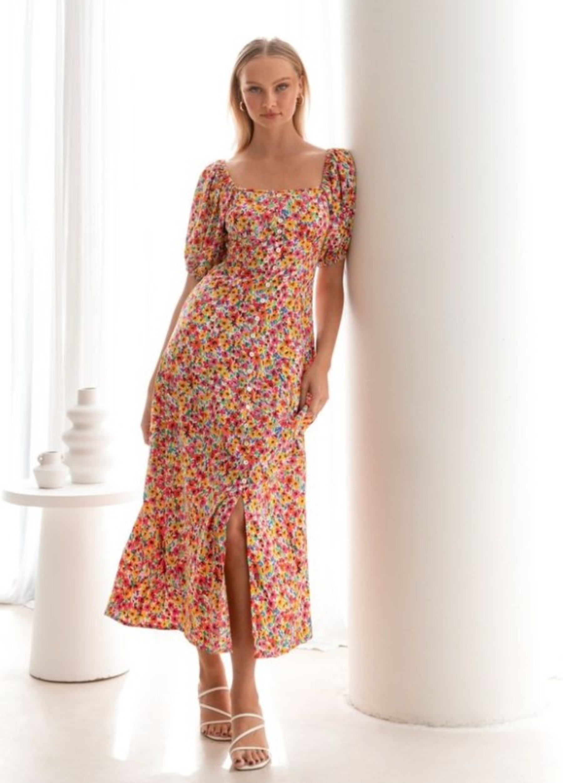 Model wearing the floral print Lucia Dress from Paper Heart