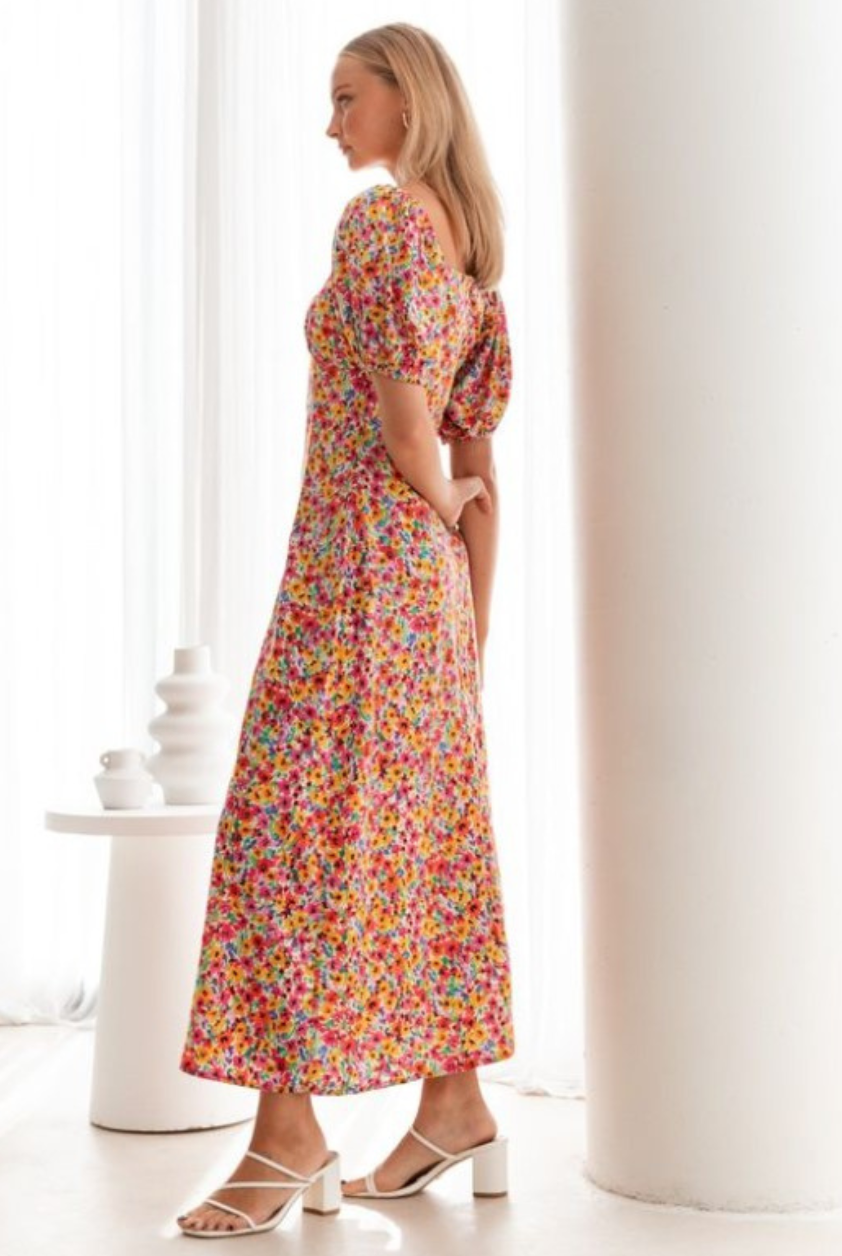 Model wearing the floral print Lucia Dress from Paper Heart