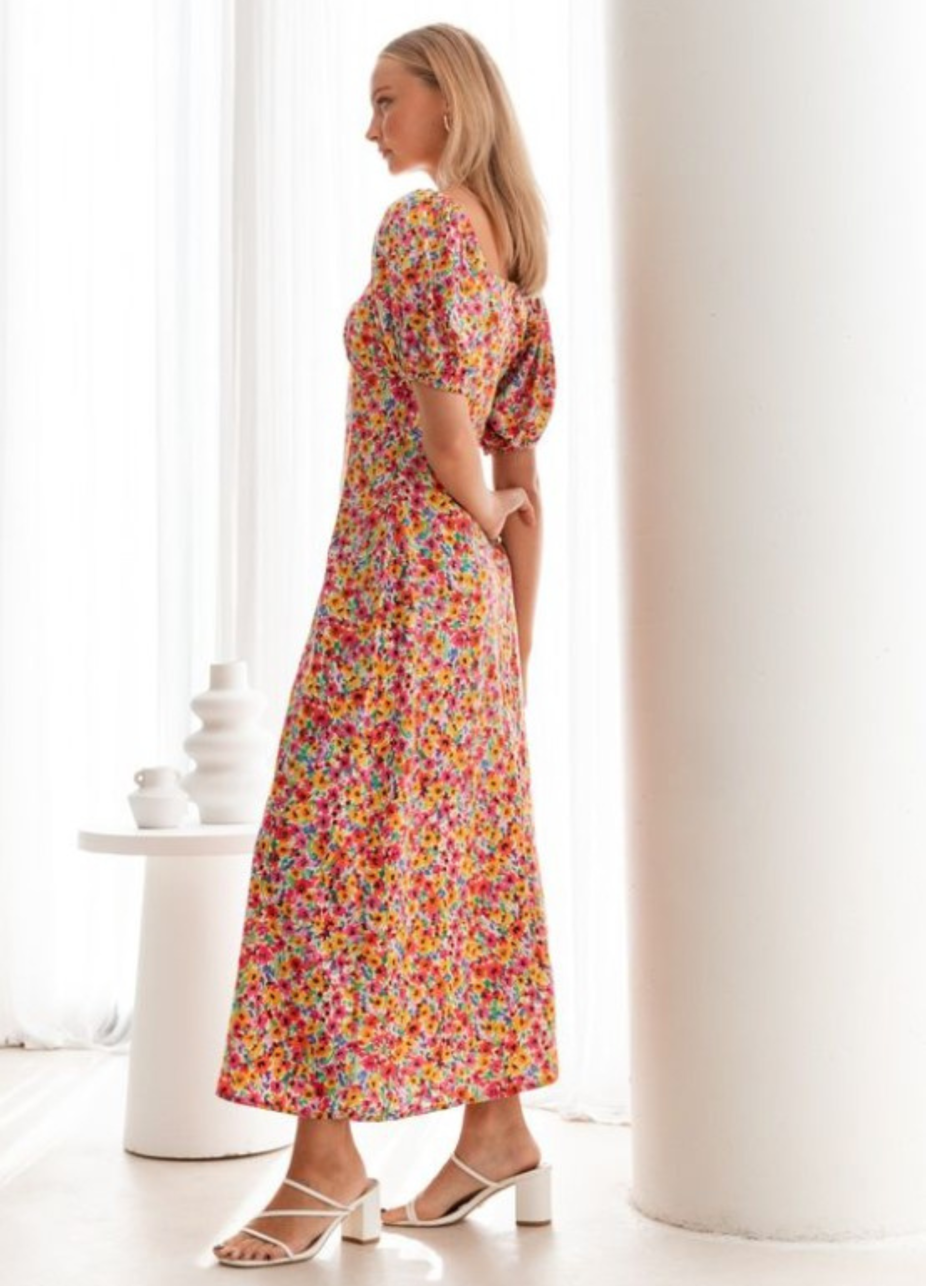 Model wearing the floral print Lucia Dress from Paper Heart