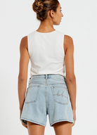 Model wearing the Bohemian Traders Mid Thigh ice wash short