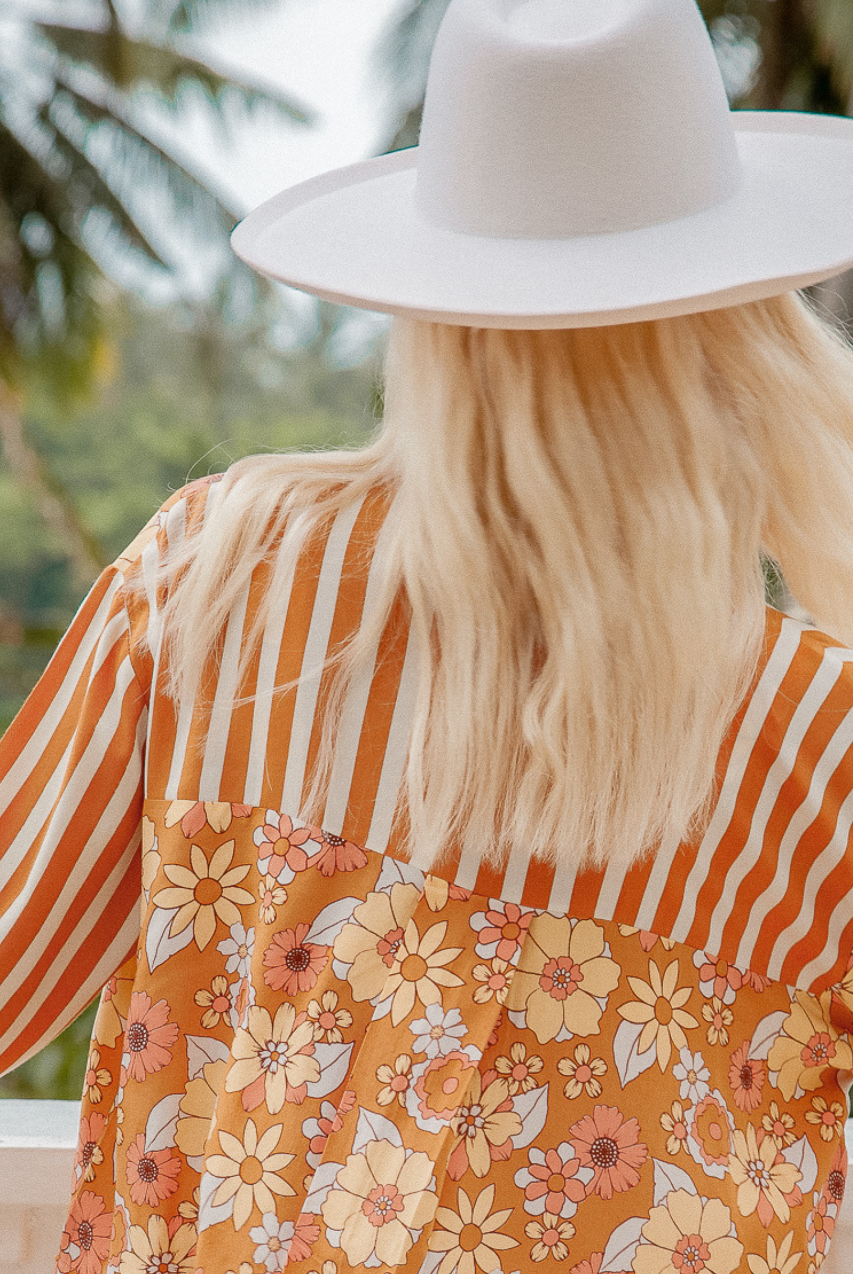 Model wearing the Sunshine Blouse from Palm Collective