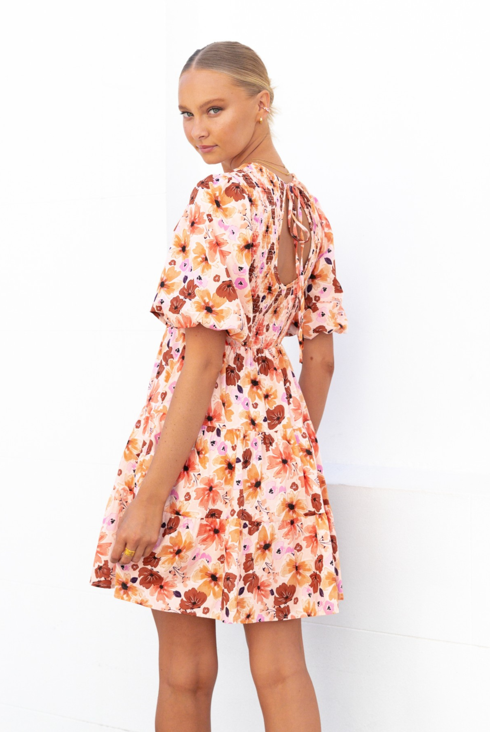 Model wearing the Paper Heart Maeve Mini Dress in Floral Print