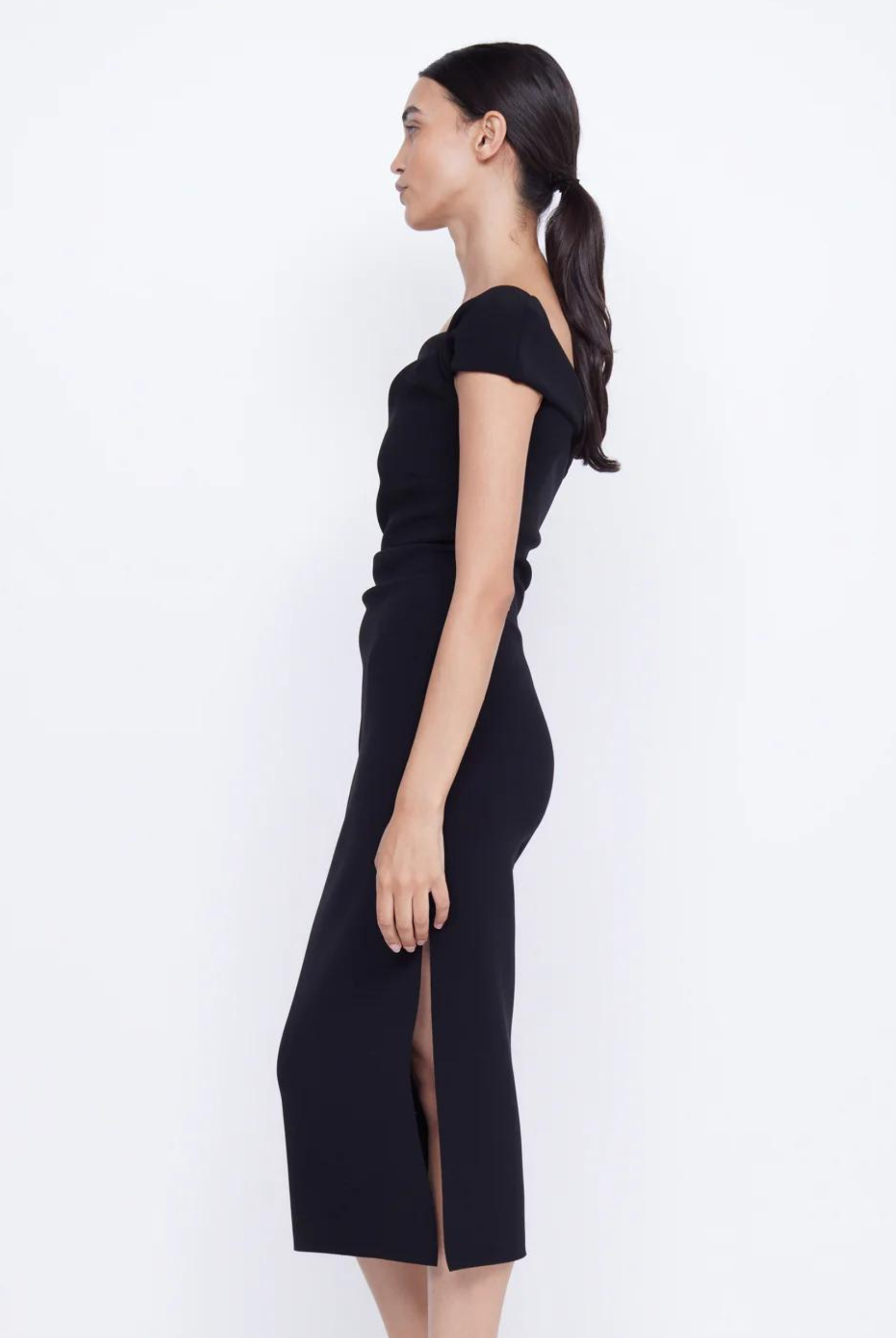 Black bonded crepe midi dress with twisted front and side tuck detailing