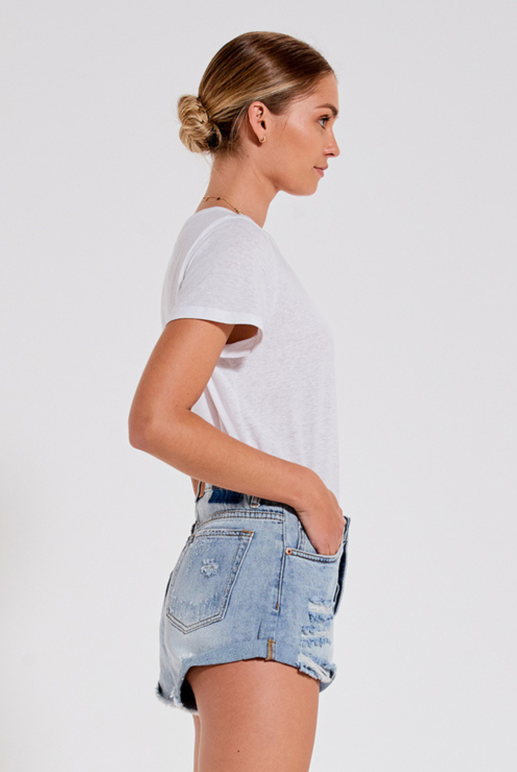 Distressed mid wash short with button closure