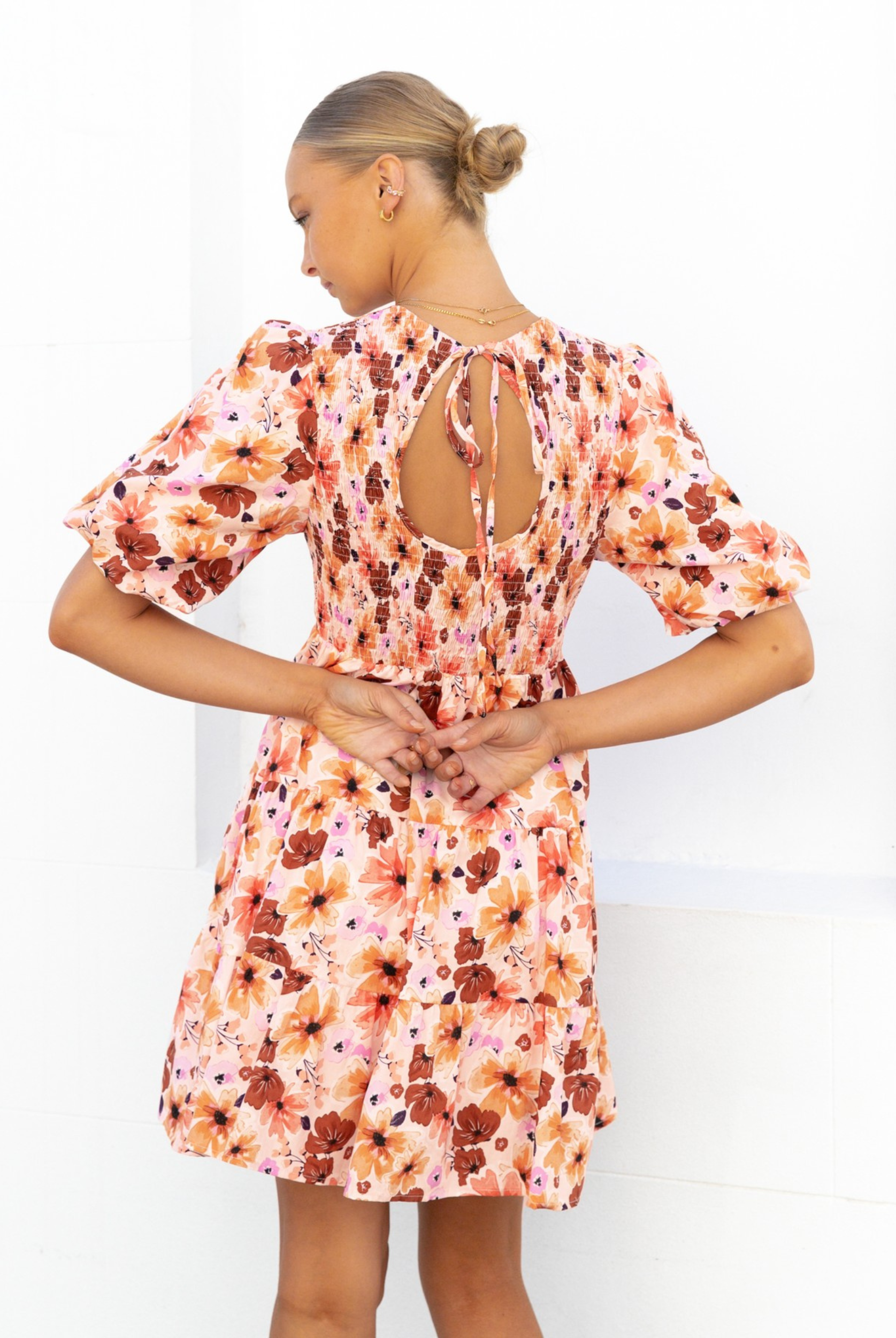 Model wearing the Paper Heart Maeve Mini Dress in Floral Print