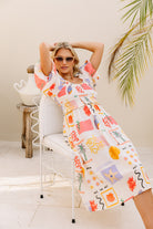 Shirred bodice midi dress in striking print inspired by Ibiza