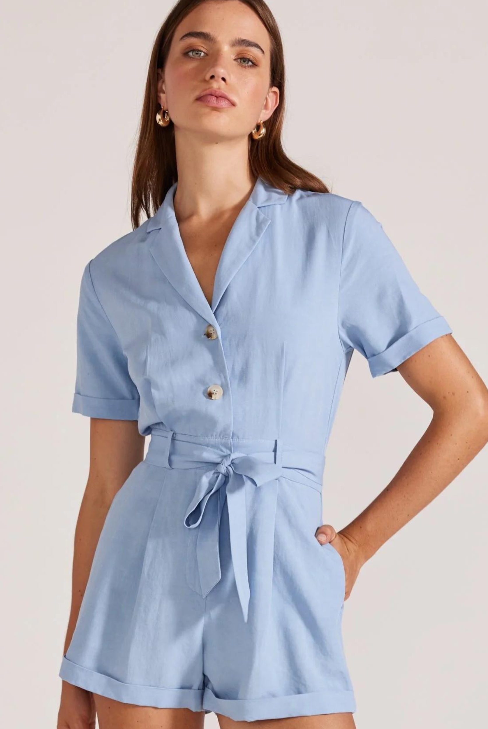 Model wearing pale blue playsuit from Staple the Label