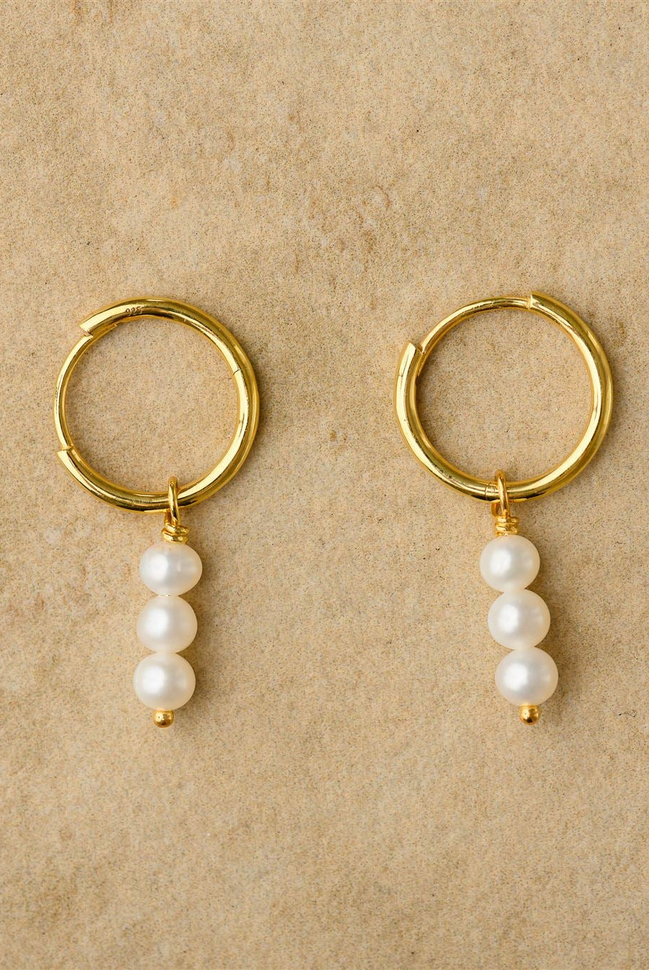 Gold earrings with pearl drops