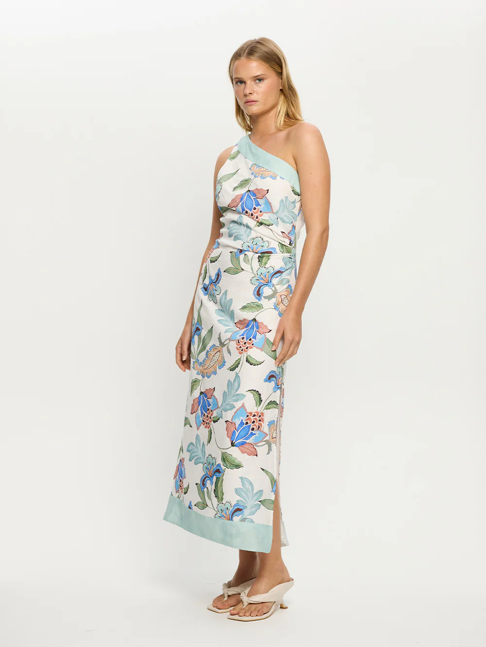 Woman wearing one shoulder floral print midi dress from Kivari Azure