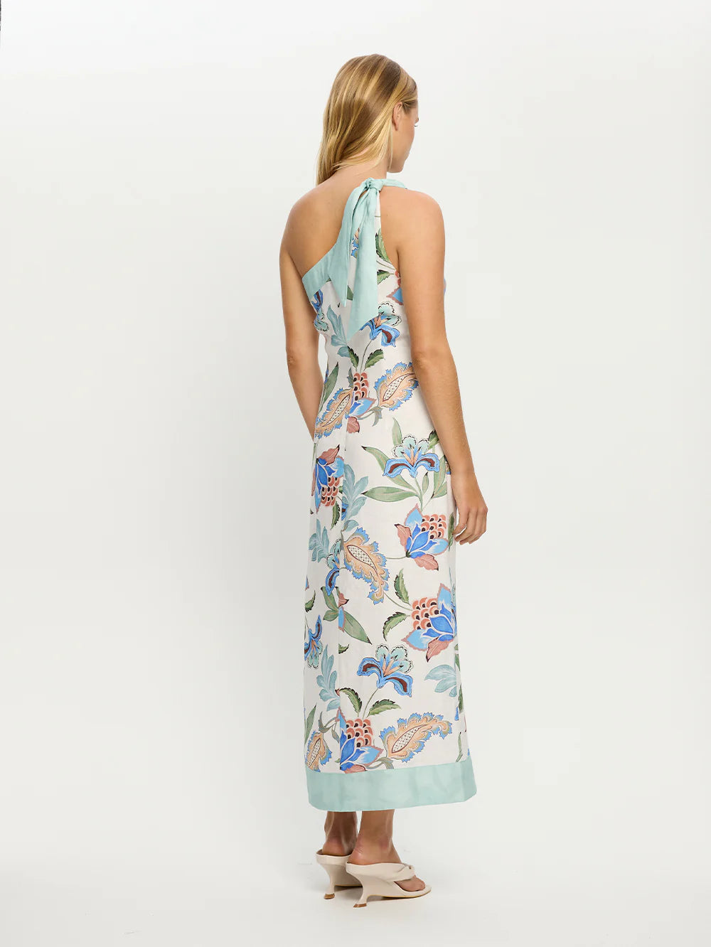 Woman wearing one shoulder floral print midi dress from Kivari Azure