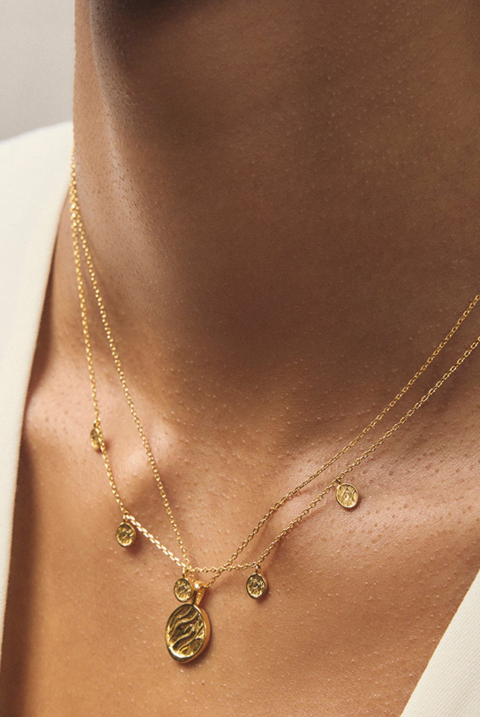 Gold charm necklace from Jolie & Deen