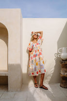 Shirred bodice midi dress in striking print inspired by Ibiza