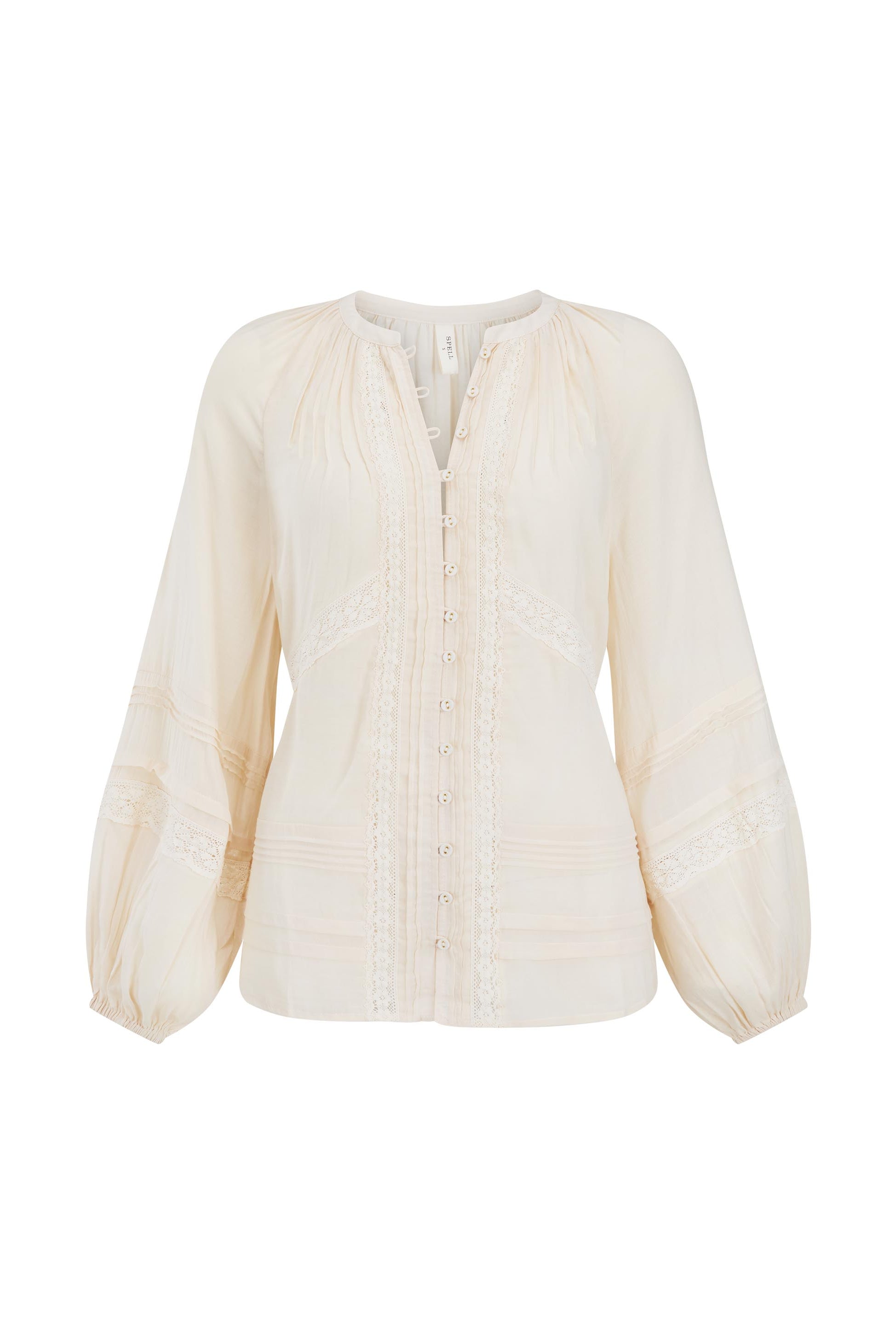 Cream-colored blouse with long sleeves on a white background
