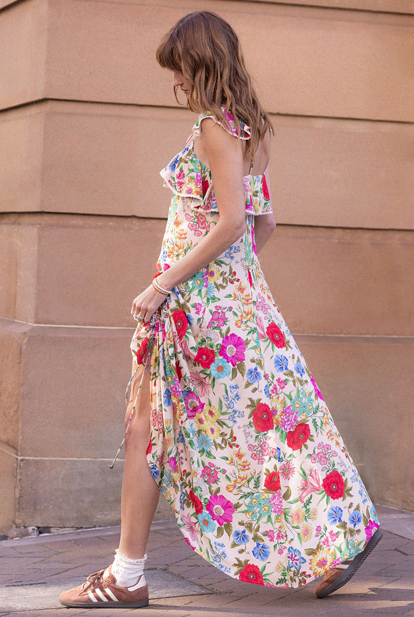 Valley of the Dolls Strappy Gown in Opal from Spell against a peach wall