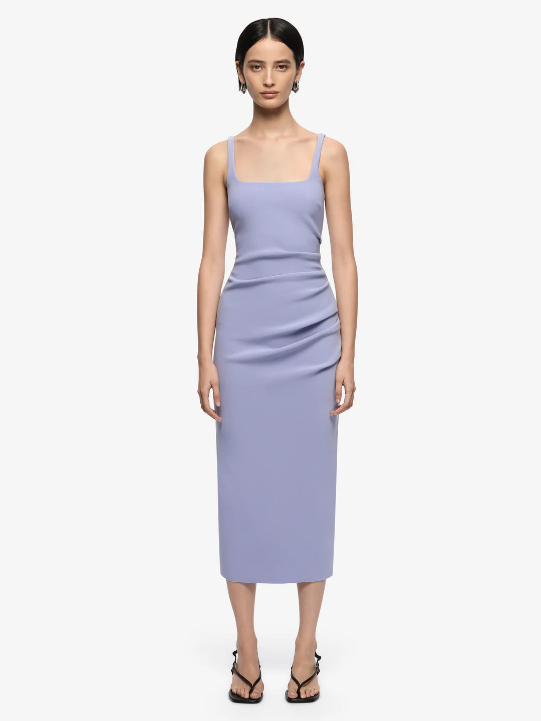 Woman wearing a light purple dress on a white background