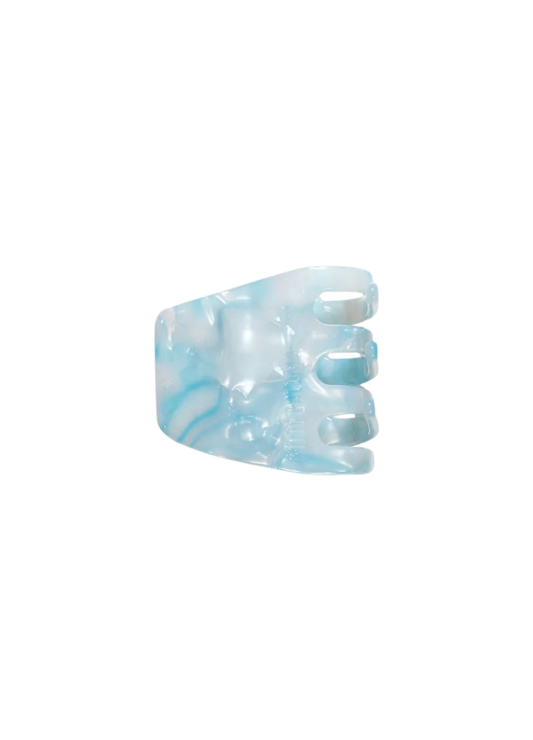 Blue and white marbled hair clip on a white background