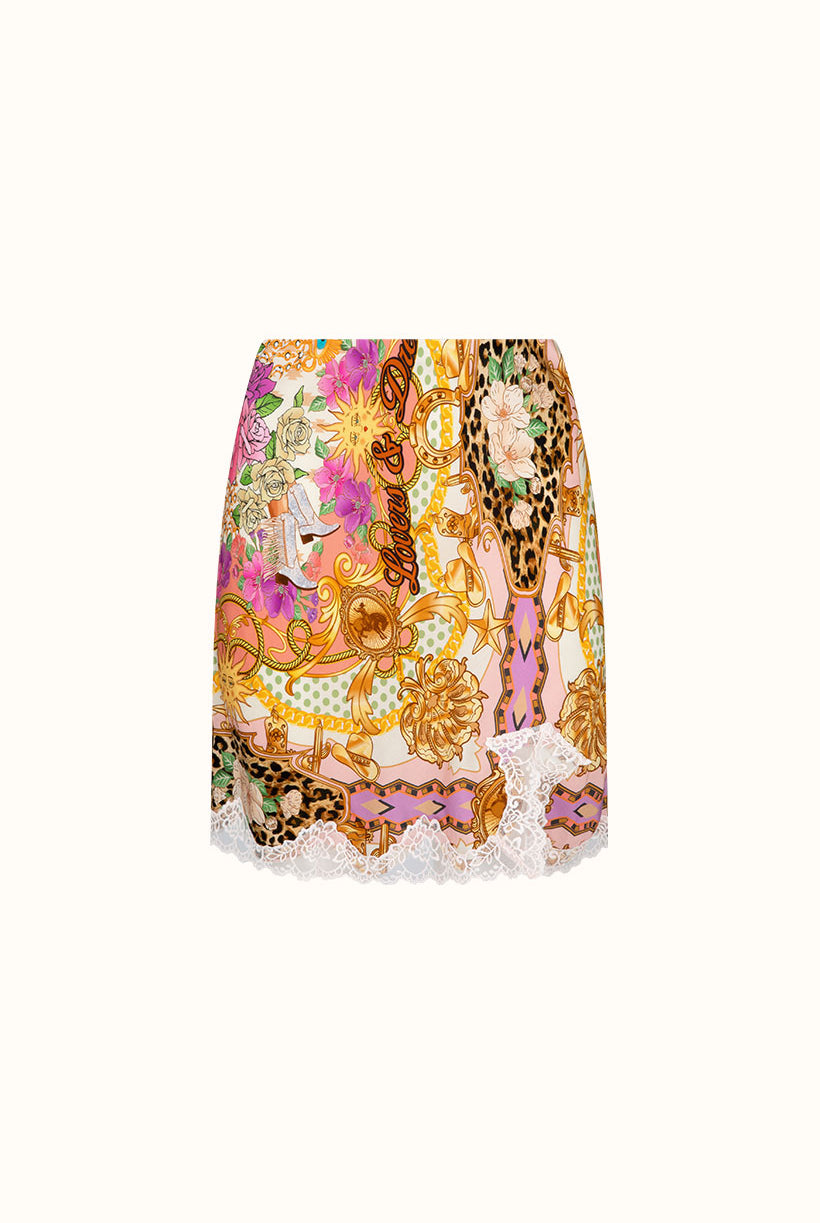 Colorful patterned skirt with floral and animal print on a white background