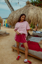 Pink tee shot on a beach from Palm Collective