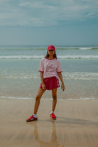 Pink tee shot on a beach from Palm Collective