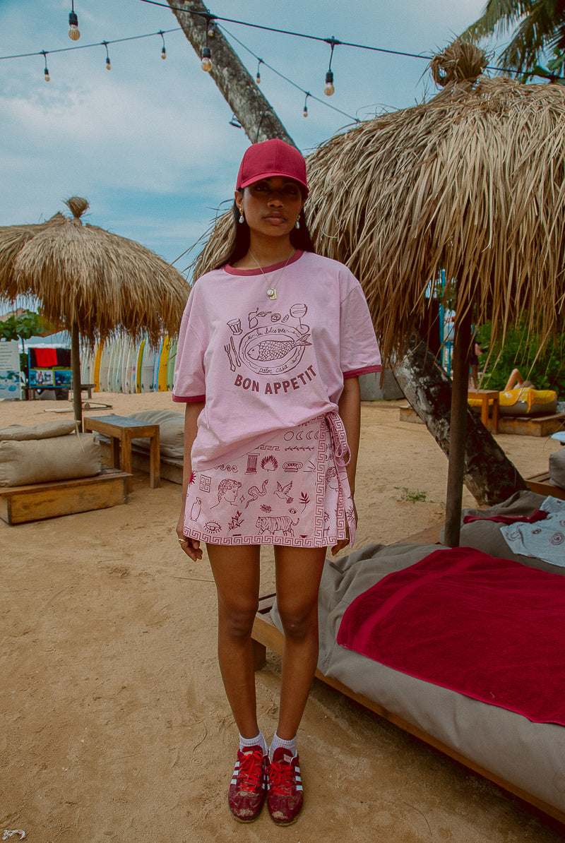 Pink tee shot on a beach from Palm Collective