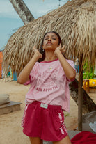 Pink tee shot on a beach from Palm Collective