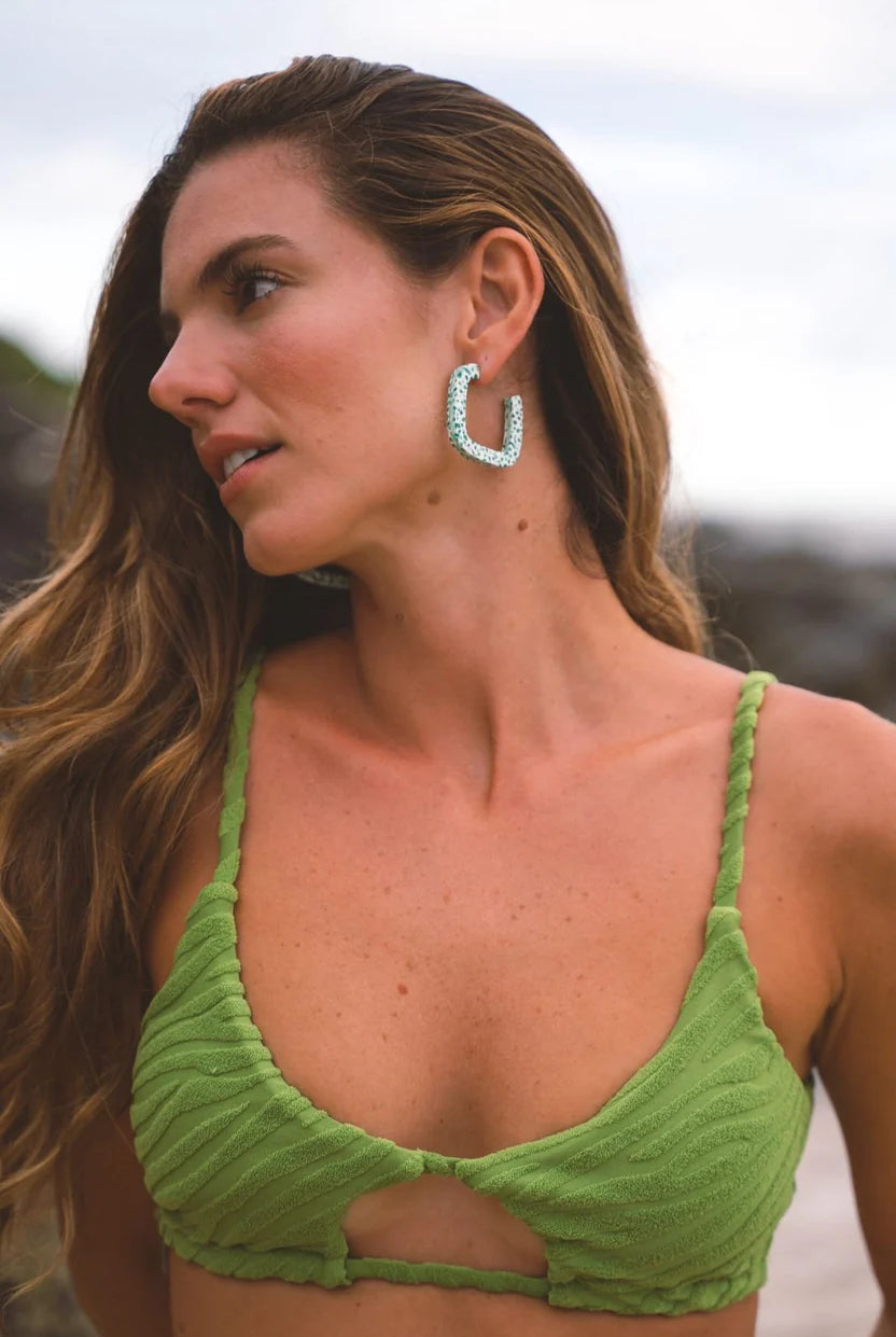 Model wearing Kitty Paloma Mint Terrazo Hoop Earrings