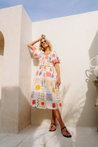 Shirred bodice midi dress in striking print inspired by Ibiza