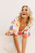 Shirred bodice midi dress in striking print inspired by Ibiza