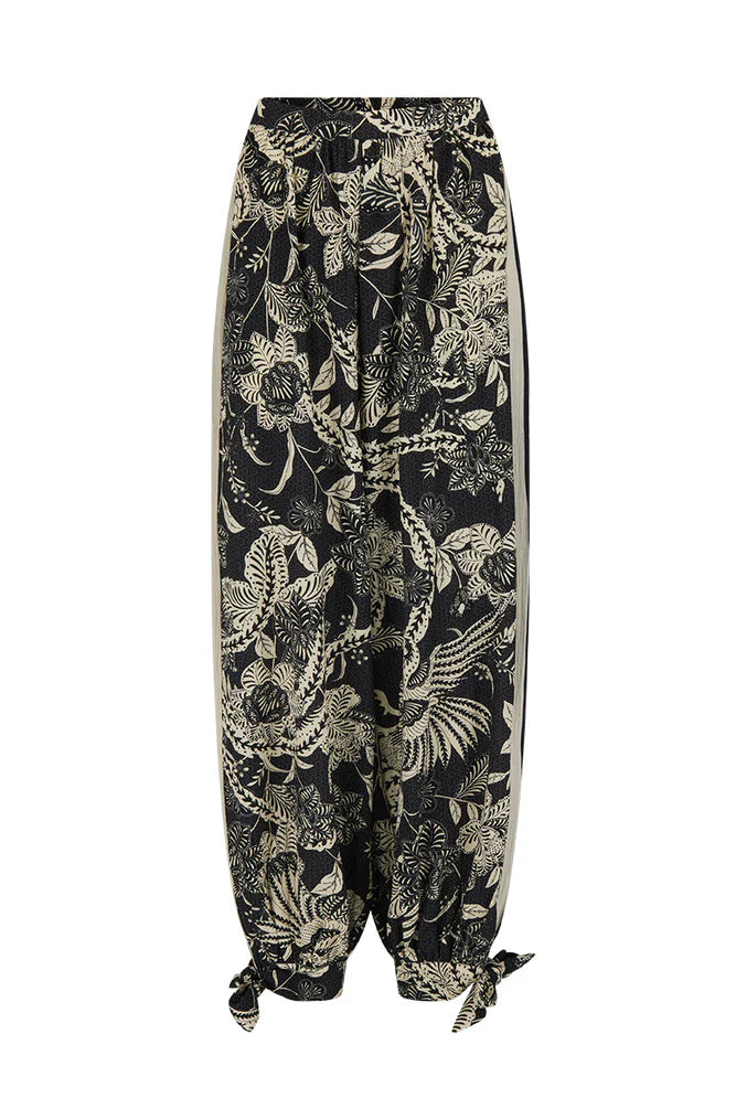 Black pants with a gold floral pattern on a white background