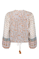 Sunshine Bandit Blouse in Desert Sage paired with blue wash jeans