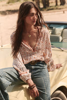 Sunshine Bandit Blouse in Desert Sage paired with blue wash jeans