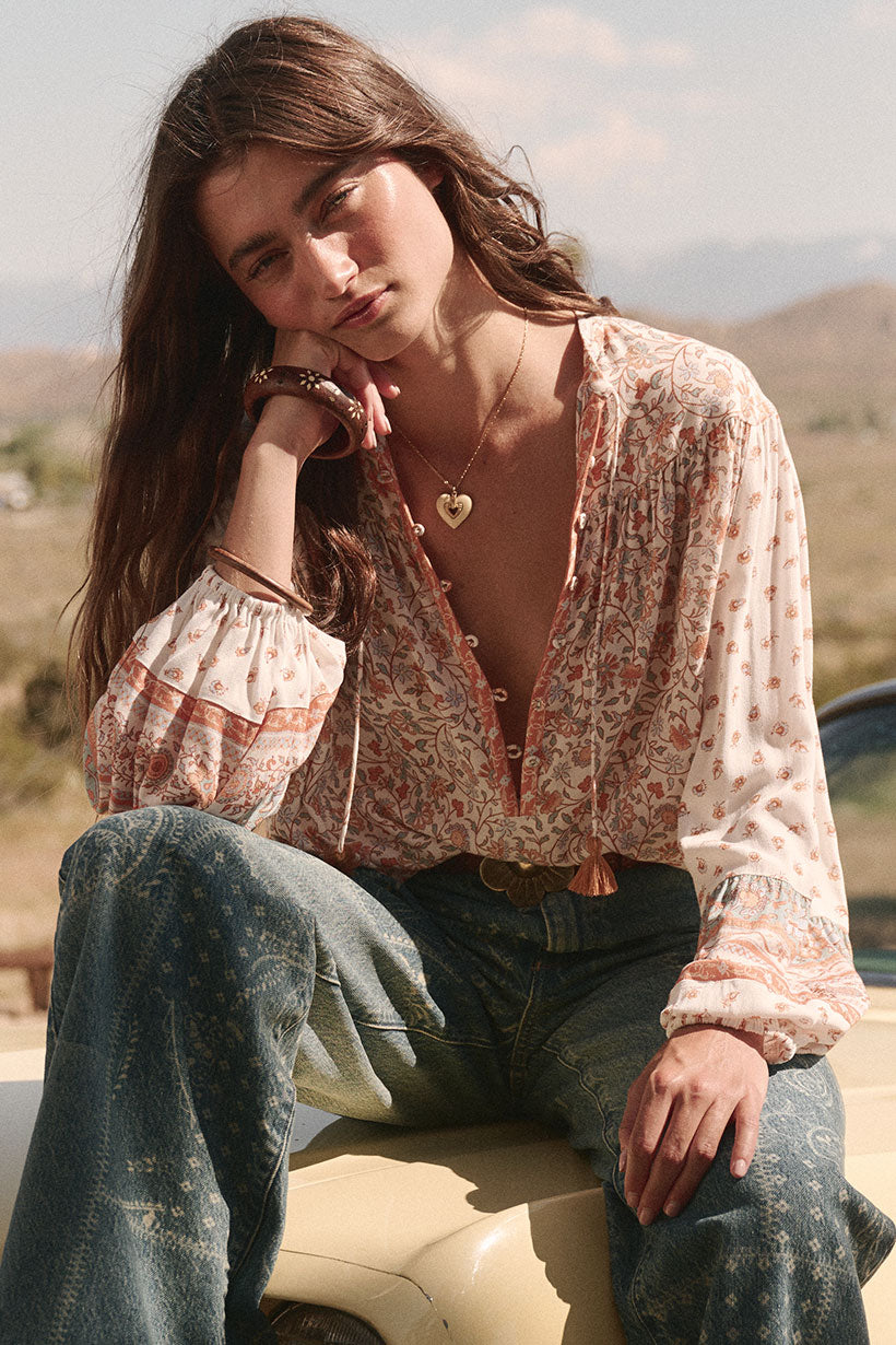 Sunshine Bandit Blouse in Desert Sage paired with blue wash jeans
