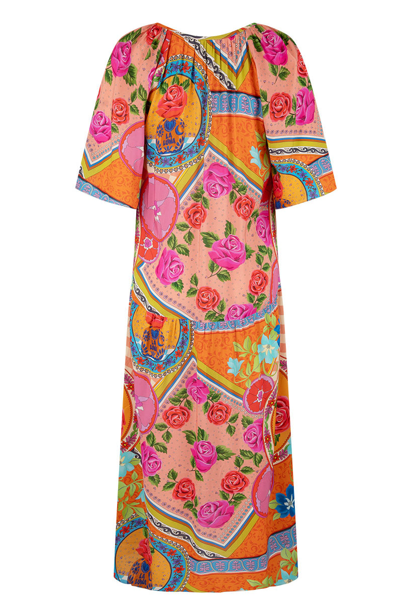 Colorful dress with floral and abstract patterns on a white background