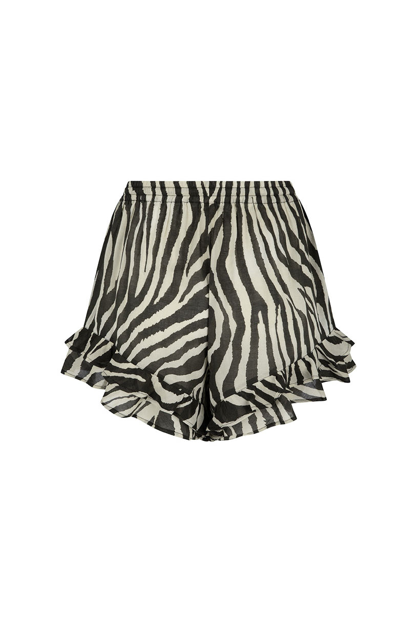 Zebra print shorts with ruffled hem on a white background