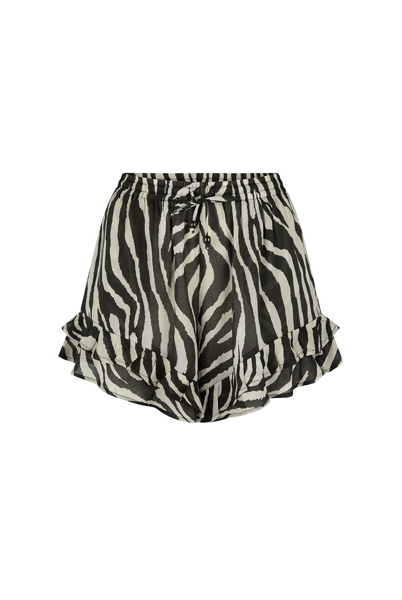 Zebra print shorts with ruffled hem on a white background