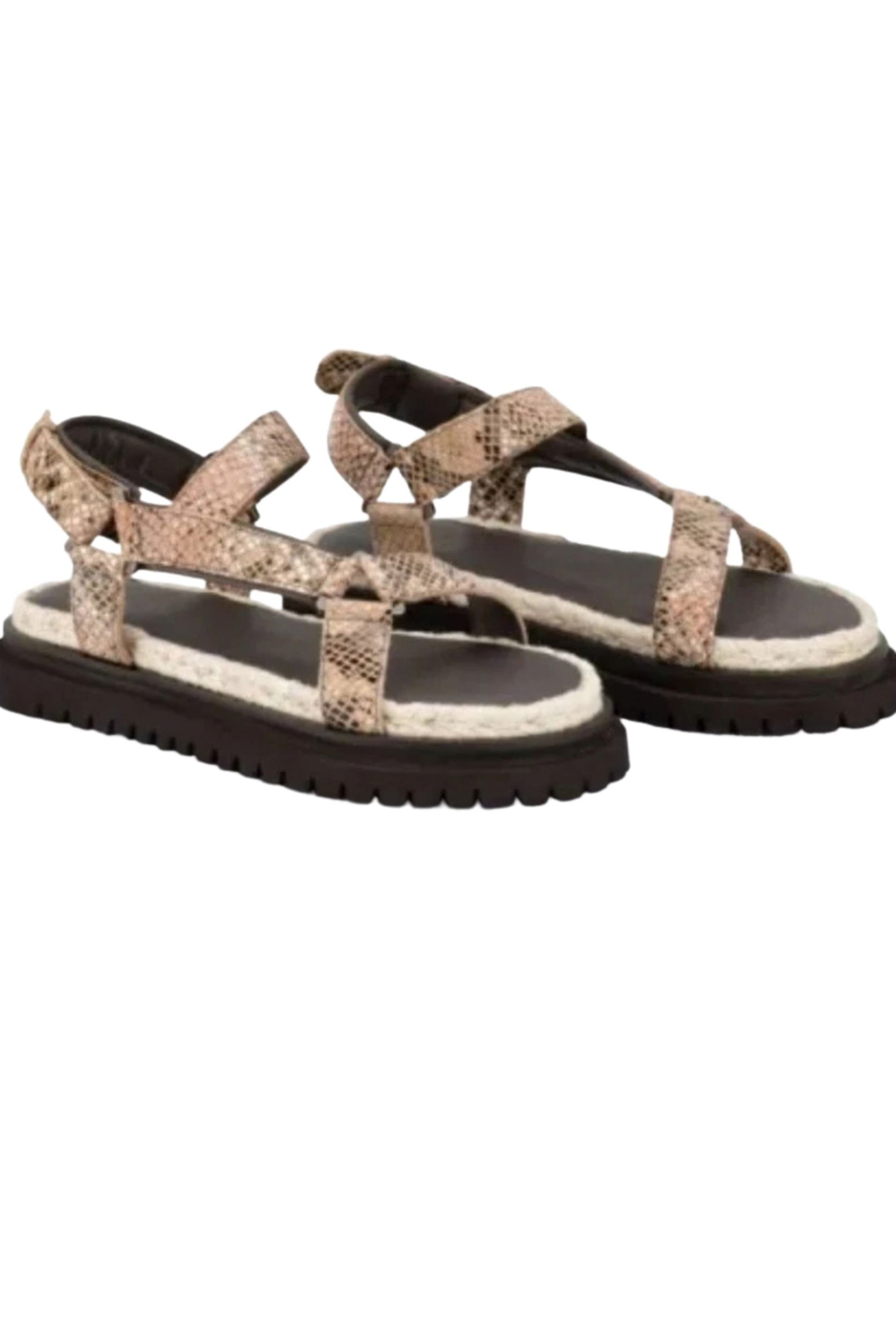 Pair of sandals with snake print straps on a white background