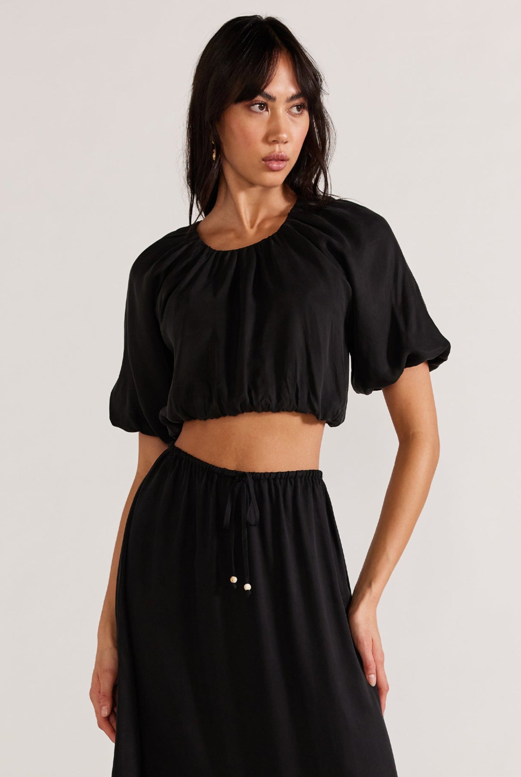 Black cropped top with matching skirt in cupro fabric from Staple the Label